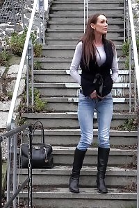 Naughty Black-haired Babe Pisses In Public On Some Steps