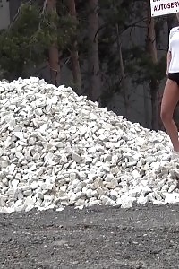 Good-looking Nag Pisses Onto A Pile Of Rubble