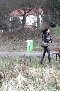 Brunette Girl Pisses On A Wooden Bench