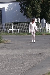 Brunette Gal Makes A Pissy Puddle On The Road
