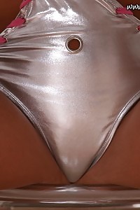 Kinley Undress Her Latex Silver Costume As She Climbs On The Table